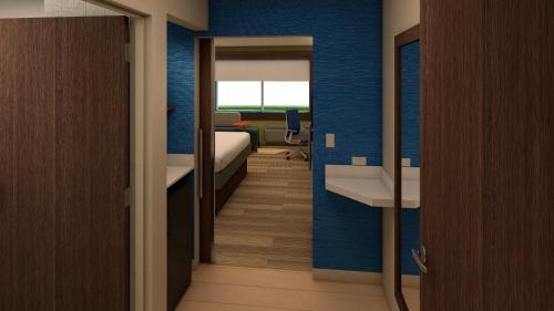 Tempat tidur dalam kamar di Holiday Inn Express & Suites - Jacksonville W - I295 and I10, an IHG Hotel