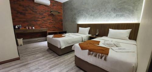 A bed or beds in a room at VISTA HOTEL