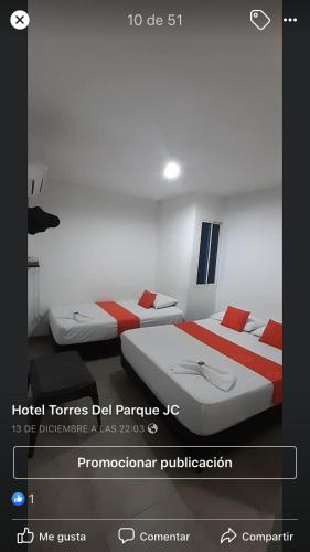 Giường trong phòng chung tại Hotel Torres del Parque No1