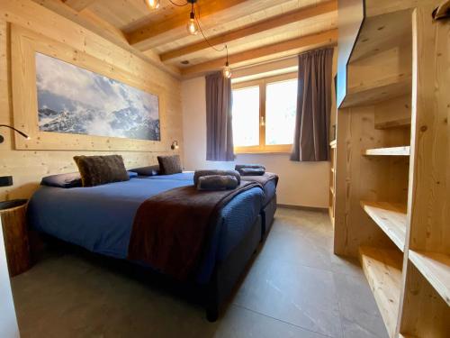 Krevet ili kreveti u jedinici u okviru objekta Carosello Lodge Livigno