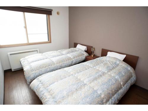 Krevet ili kreveti u jedinici u okviru objekta Guest House Tou - Vacation STAY 26333v