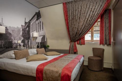 Łóżko lub łóżka w pokoju w obiekcie Hotel Hulsman