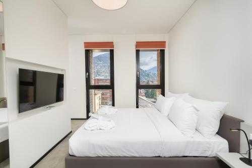 Krevet ili kreveti u jedinici u objektu Swiss Hotel Apartments - Lugano