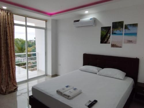 Giường trong phòng chung tại Hostal Las Orquideas