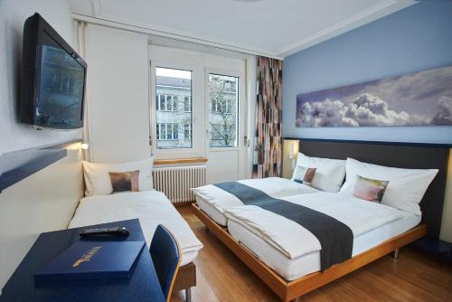 Ένα ή περισσότερα κρεβάτια σε δωμάτιο στο Hotel Bristol Zurich