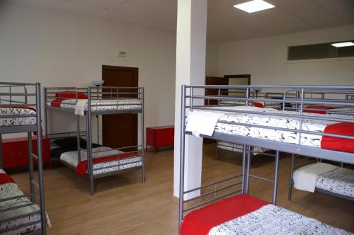 Grelo Hostel tesisinde bir odada yatak veya yataklar