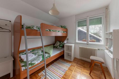 A bed or beds in a room at Vrtnarjeva hiša, The Gardener's Cottage