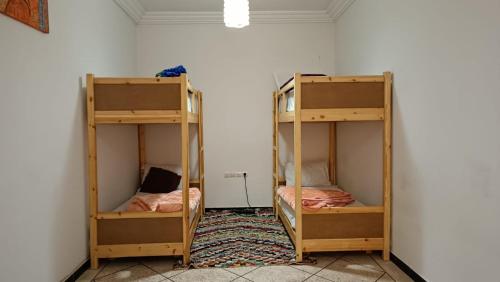 Llit o llits en una habitació de Afgo Hostel