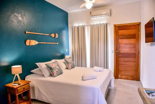 Tempat tidur dalam kamar di Villa Samoa - Ilhabela