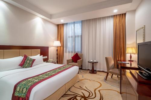 Katil atau katil-katil dalam bilik di Grand Metropark Hotel Shandong