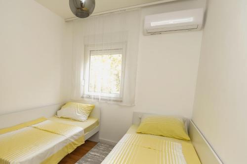 Postel nebo postele na pokoji v ubytování Apartman Darija 1