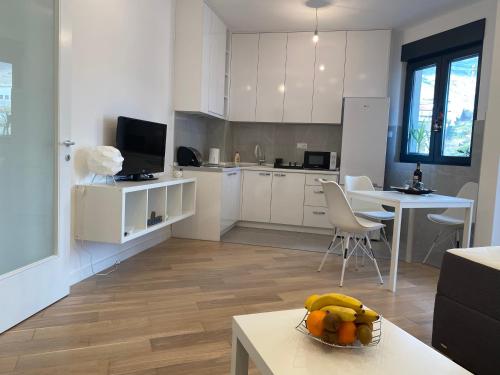 Virtuvė arba virtuvėlė apgyvendinimo įstaigoje Apartman PORTO