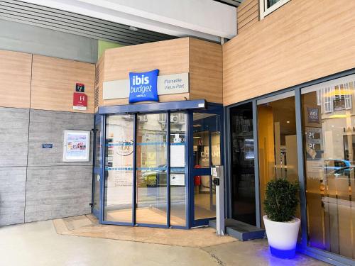 an entrance to a ups store with its doors open at ibis budget Marseille Vieux Port in Marseille