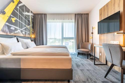 Ліжко або ліжка в номері Aiden by Best Western Stadtgut Hotel Steyr - FREE PARKING