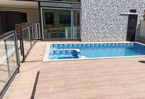 a swimming pool in the middle of a house at HOTEL CAPITAL PALMAS in Palmas