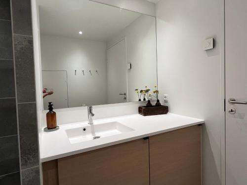 A bathroom at Apartment directly to seafront of Bassin 7 with big balcony and free parking