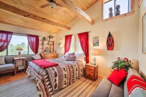 1 dormitorio con 1 cama y 1 sofá en Idyllic Dolores Cabin with Fire Pit and Lake Views!, en Dolores