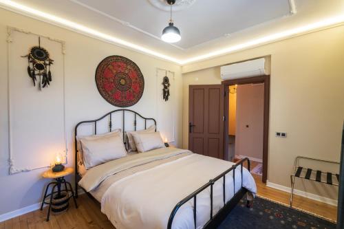 a bedroom with a large bed in a room at Cozy Home in Oldtown Kaleici in Antalya