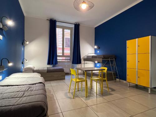 Кровать или кровати в номере Palladini Hostel Rome