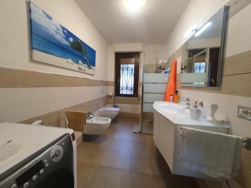 a bathroom with a sink and a toilet at Asinara in Sassari