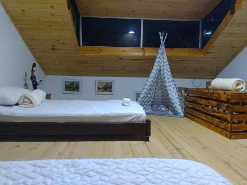 Tempat tidur dalam kamar di Chalet Laguna Sagrada de Fuquene