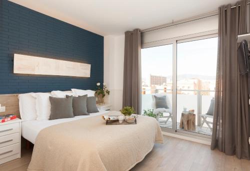 Voodi või voodid majutusasutuse Enjoybcn Marina Apartment toas