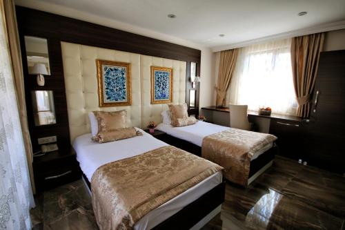 Cama ou camas em um quarto em Venus Suite Hotel