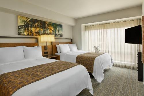 Un pat sau paturi într-o cameră la Marriott Vacation Club®, San Diego   