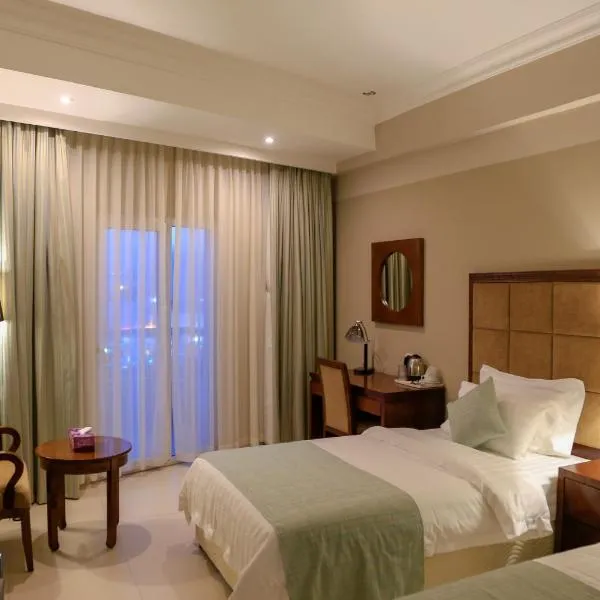 Muscat Inn Hotel: Sayḩ adh Dhabi şehrinde bir otel