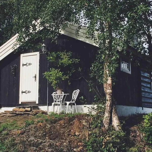 Sjarmerende tømmerhytte på gårdstun, hôtel à Vinstra