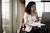 Businesswoman working on laptop in an office