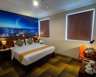 Miyana Hotel - Medan - Schlafzimmer