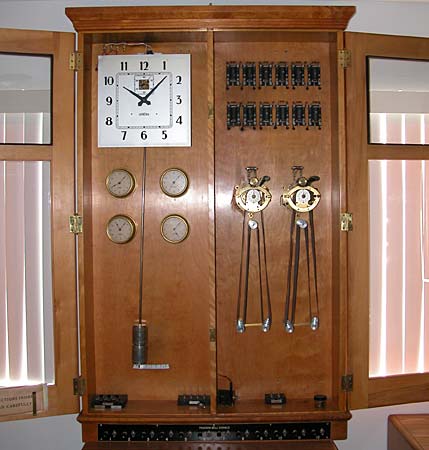 1950s master clock in double-width double-door case