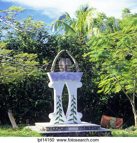 Stock Photography of Independence monument with a Coco de Mer nut.