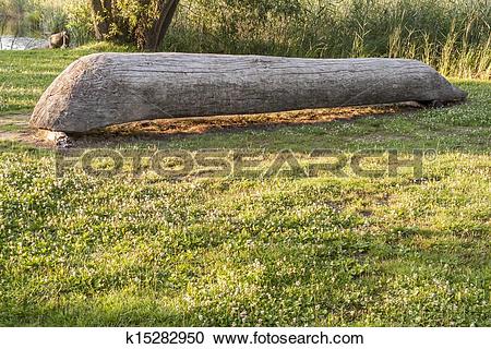 Stock Photography of Old wooden canoe in Biskupin Museum.