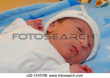 Stock Images of Newborn baby boy at hospital nursery, 1 day old.