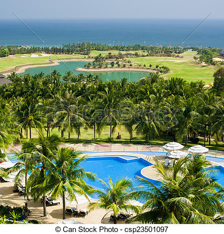 Stock Photographs of Tropical lhotel with swimming pool and golf.