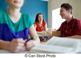 Stock Photo of group of happy students talking at school break.