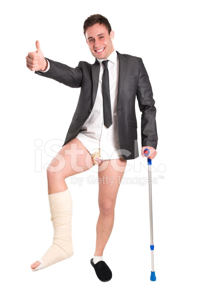 Young Businessman With Crutches, Broken Leg and Thumbs UP.