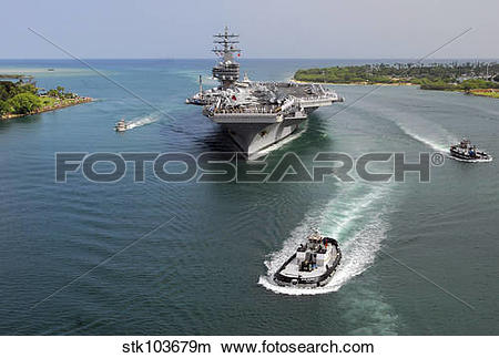 Stock Photo of Aircraft carrier USS Ronald Reagan transits Pearl.