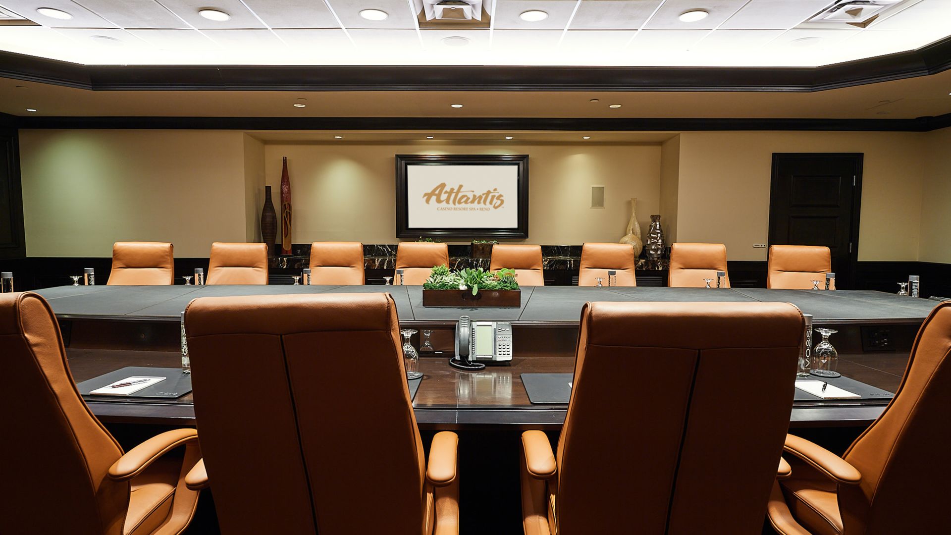 A Conference Room With A Large Table And Chairs