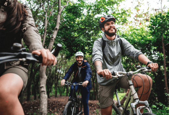 friends cycling in the woods