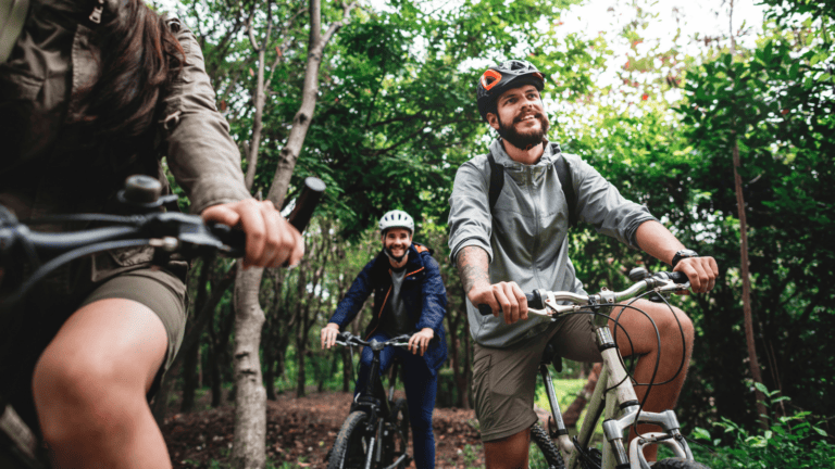 friends cycling in the woods