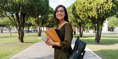 Support Teacher stood in park