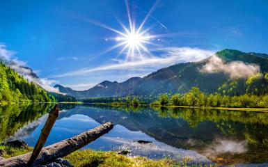 Sun Over The Mountain Lake