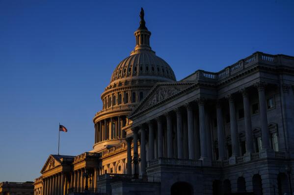 FILE - Sunrise at the U.S. Capitol, Monday, Dec. 19, 2022, on Capitol Hill in Washington. Republicans and Democrats are being forced to confront critical questions about the people and policies they want to represent them as the next election season roars into view. (AP Photo/Matt Rourke, File)