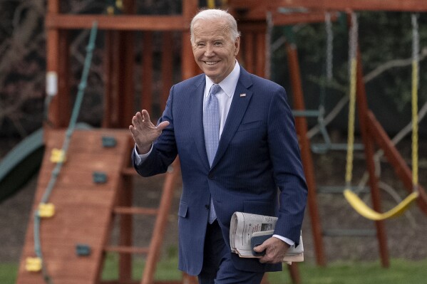 President Joe Biden waves to members of the media as he walks toward Marine One on the South Lawn of the White House in Washington, Friday, March 22, 2024, to travel to Wilmington, Del. (AP Photo/Andrew Harnik)