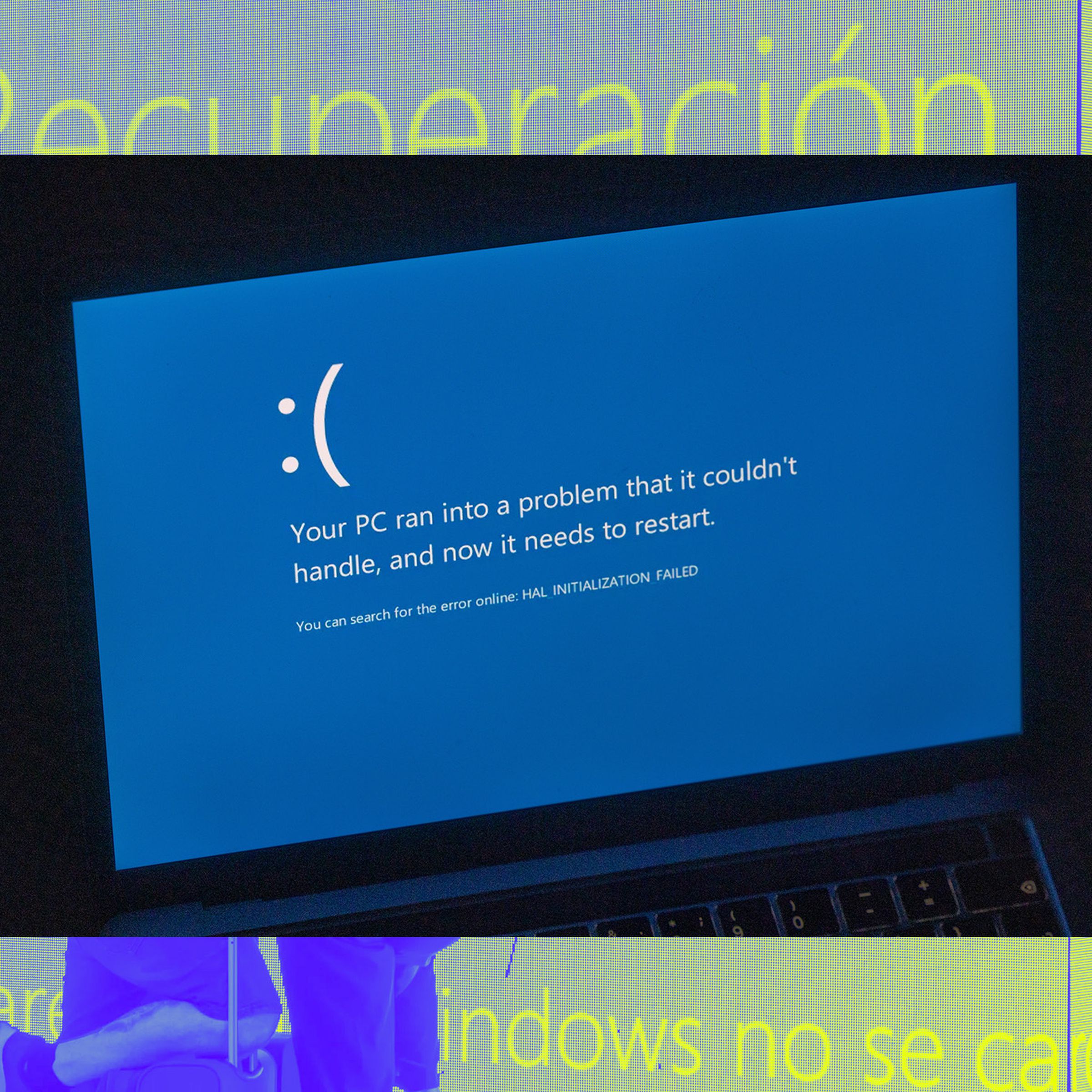 An image of a crashed Windows PC over a Vergecast illustration