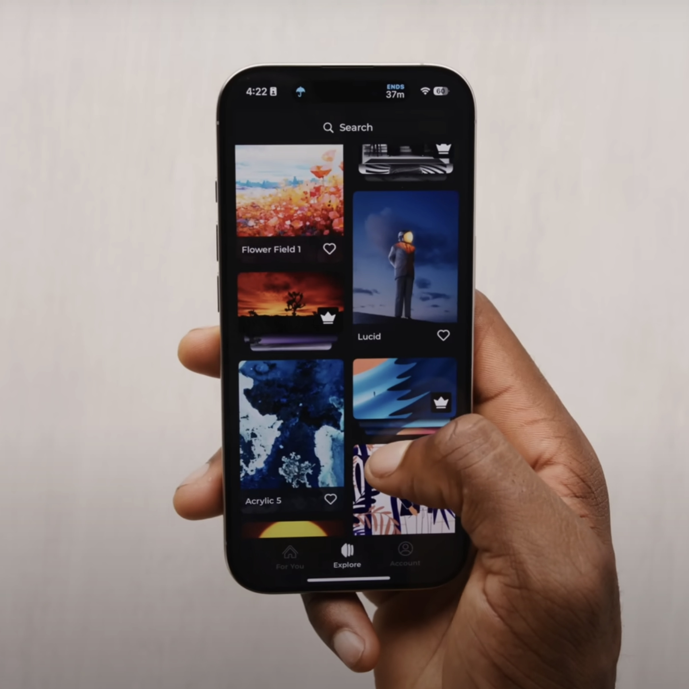 An image showing Marques Brownlee holding up a phone with the Panels app open