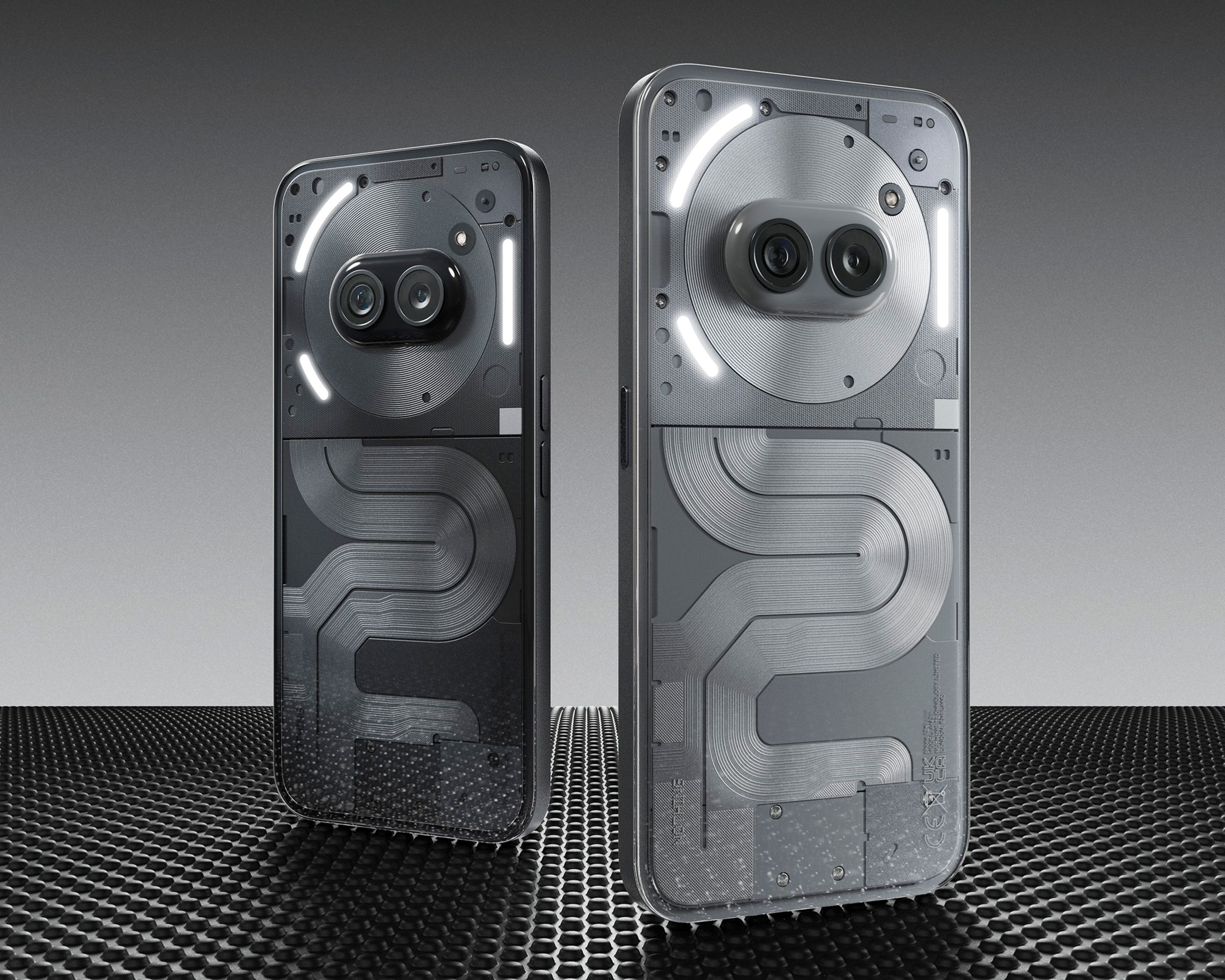The black and gray versions of the Nothing Phone 2A Plus standing side by side.